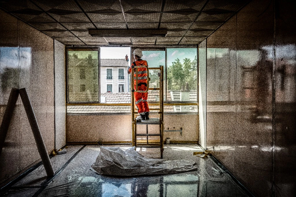 Construction work - worker on ladder